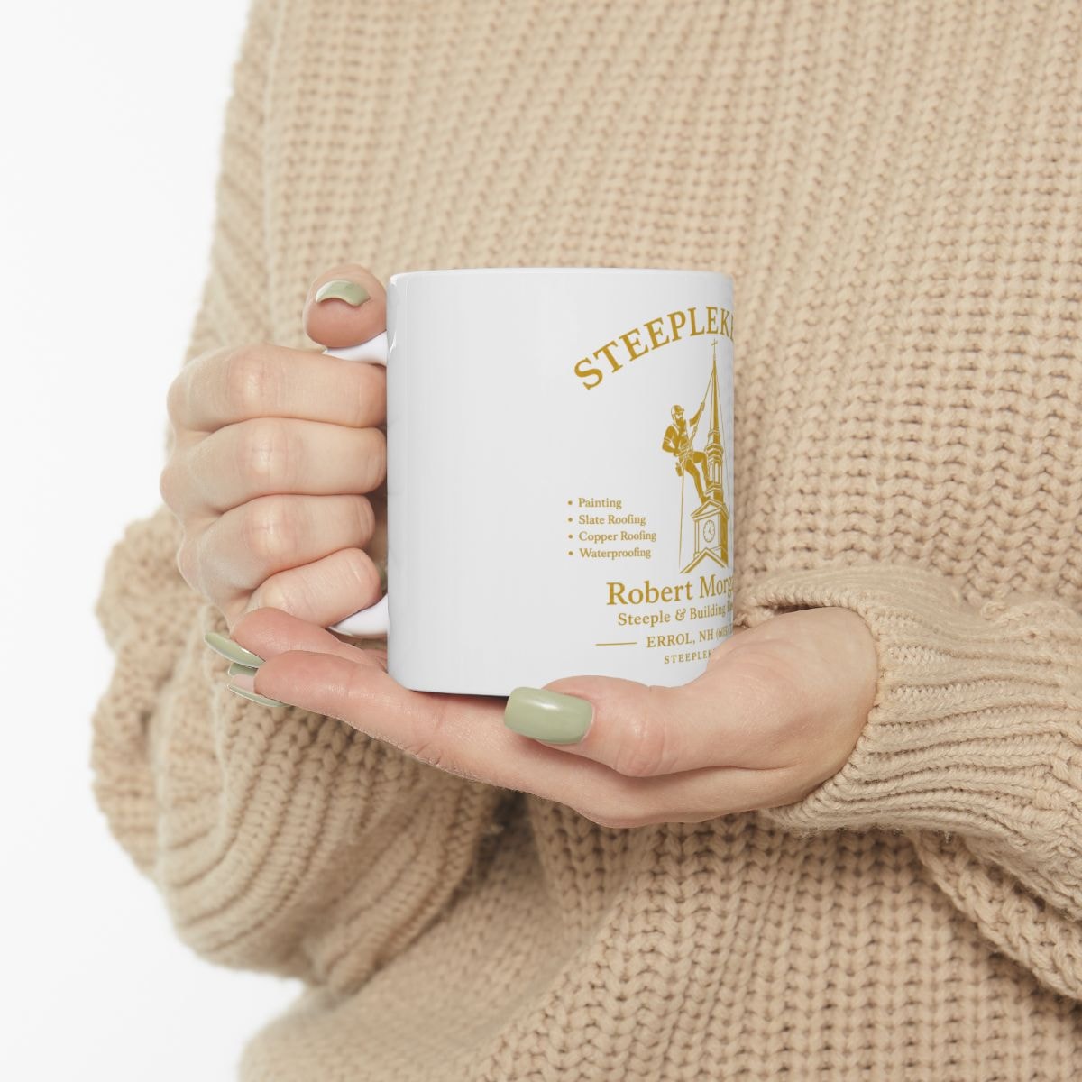 Steeplekeeper white coffee mug with gold Robert Morgan Co. logo held in hand